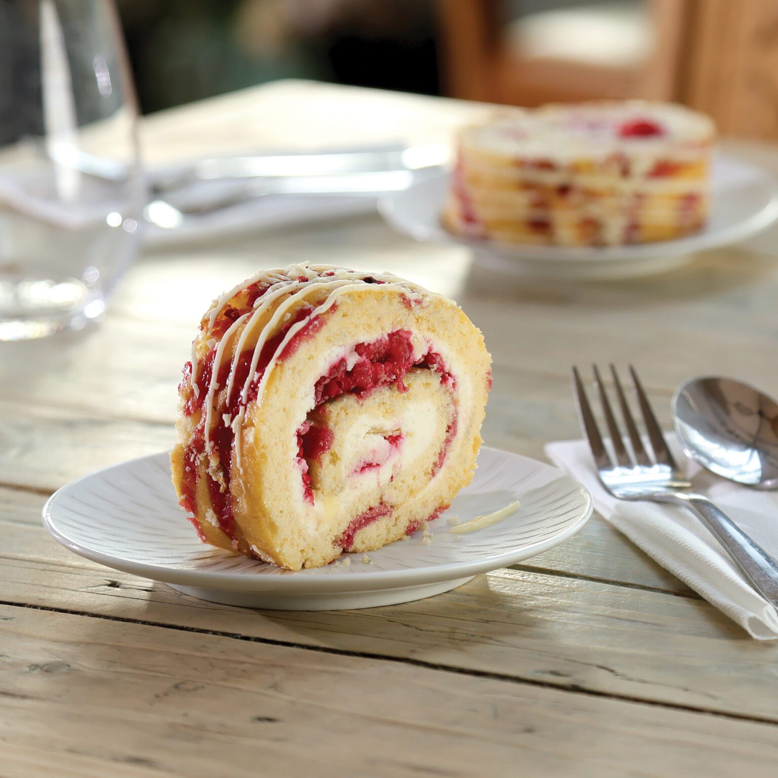 White Chocolate & Raspberry Roulade - Mademoiselle Desserts UK