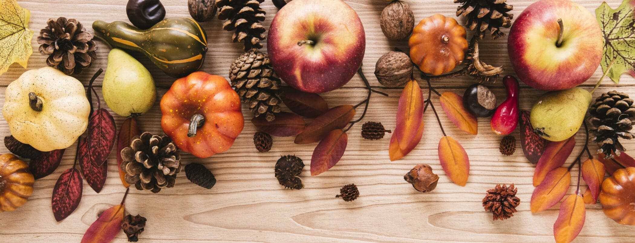 top-view-autumn-food-with-wooden-background-1-2100x804